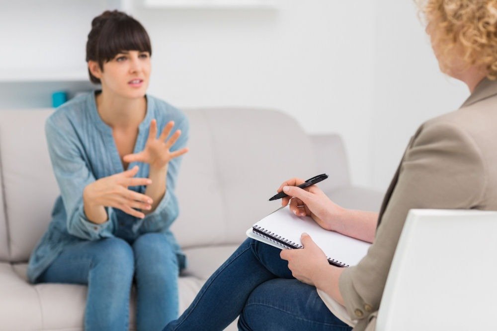 a woman talking to her therapist duringtherapy