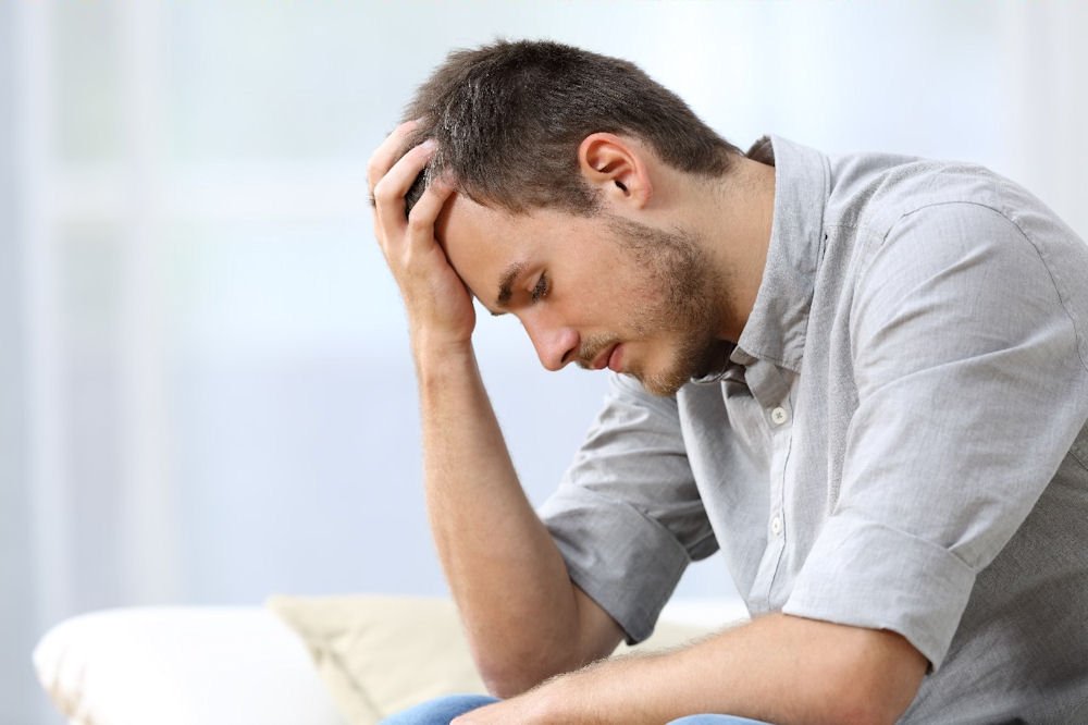 Man showing signs of emotional distress, possibly related to ketamine misuse